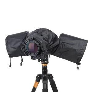 DSLR camera fully enclosed in a black rain cover mounted on a tripod, lens exposed for shooting.